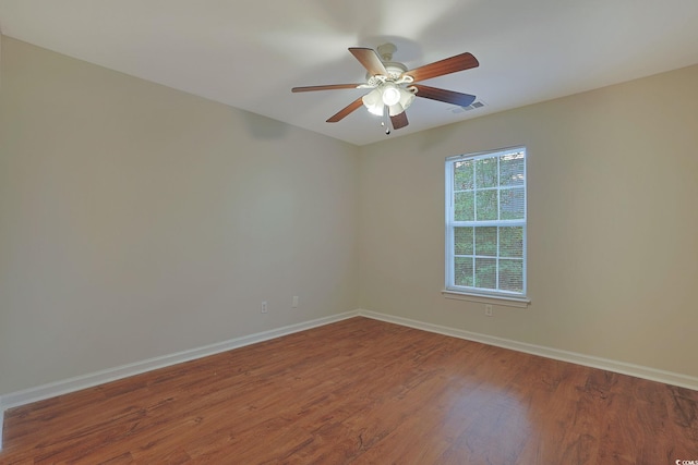 empty room featuring ceiling fan and hardwood / wood-style flooring