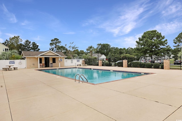 view of swimming pool with a patio area