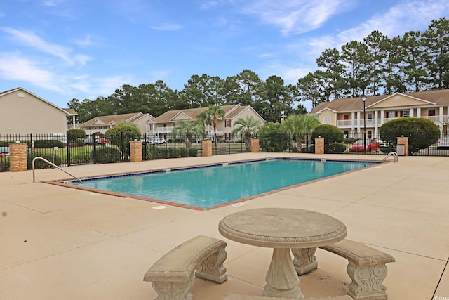 view of swimming pool with a patio area