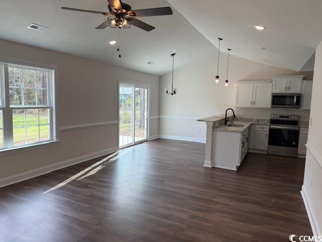 kitchen featuring dark wood-type flooring, white cabinetry, sink, and stainless steel appliances