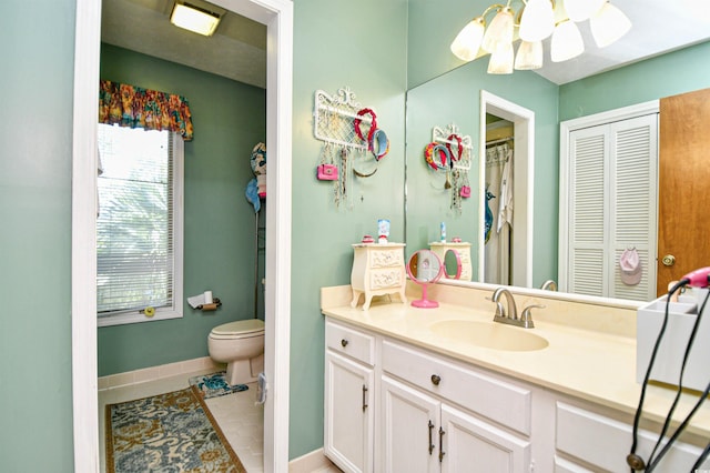 bathroom featuring vanity, toilet, and tile patterned floors