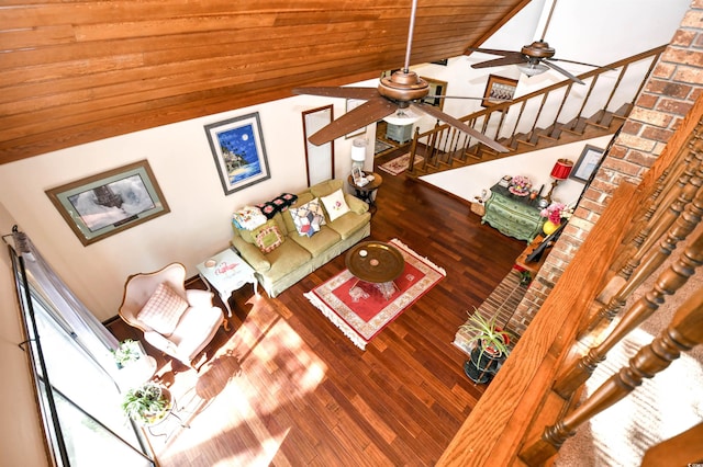 living room featuring ceiling fan, wood ceiling, hardwood / wood-style floors, and vaulted ceiling