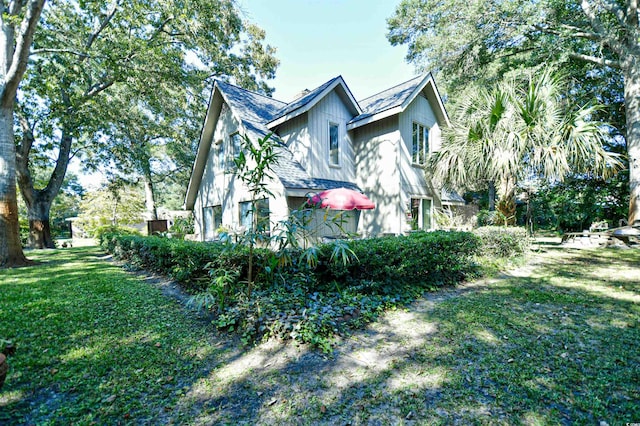 view of property exterior featuring a yard