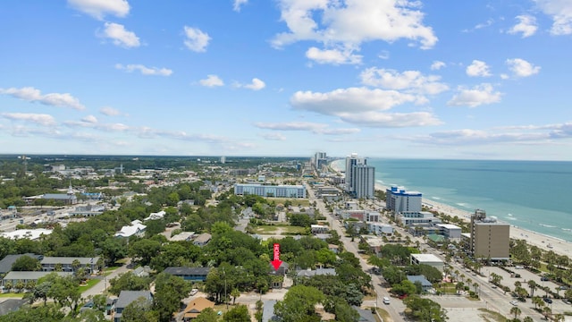 bird's eye view featuring a water view and a beach view