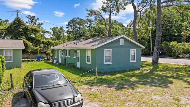 view of property exterior with a lawn