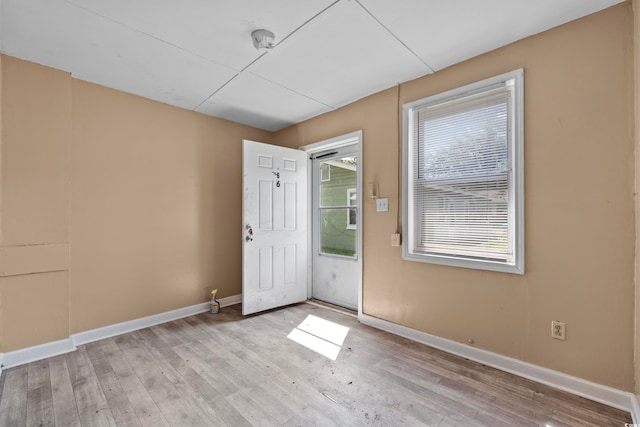 spare room with light hardwood / wood-style floors