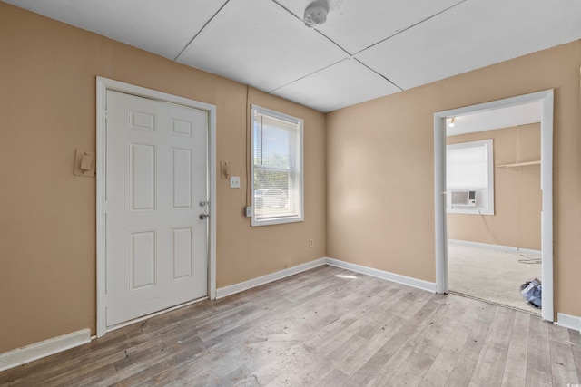 foyer entrance featuring light hardwood / wood-style floors and cooling unit