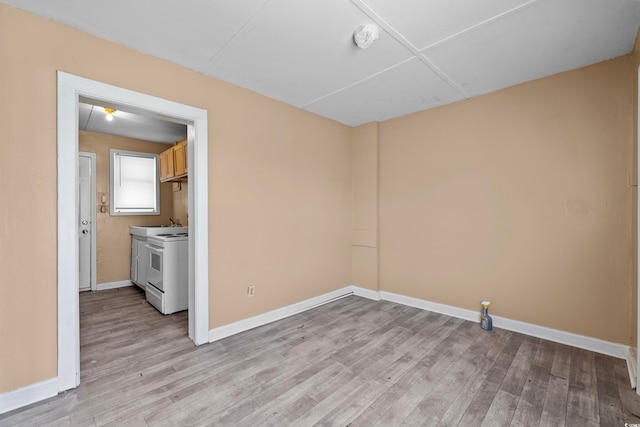 spare room with light hardwood / wood-style floors