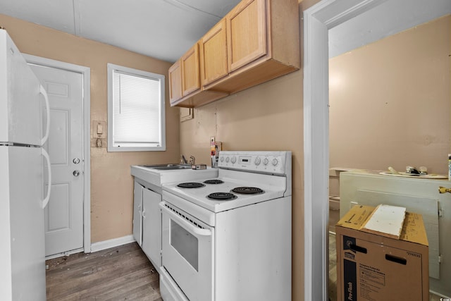 kitchen with light brown cabinets, dark hardwood / wood-style floors, sink, and white appliances