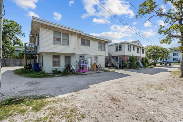 view of front of home with a balcony