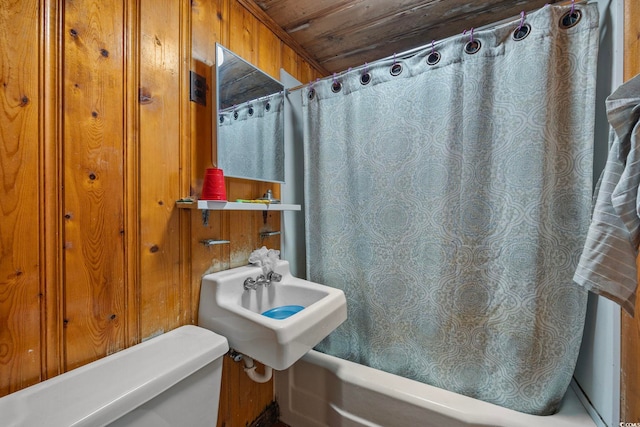 bathroom with shower / bath combo with shower curtain, wood ceiling, and toilet