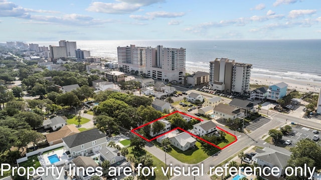 aerial view with a view of the beach and a water view