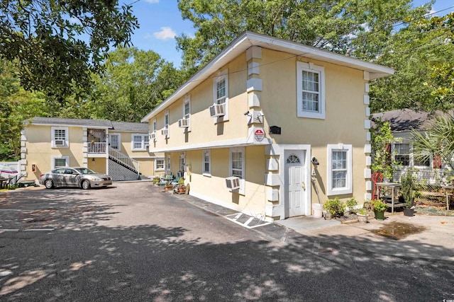 view of front of home featuring cooling unit