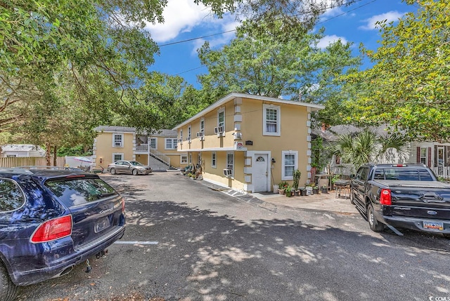 view of front of home featuring cooling unit