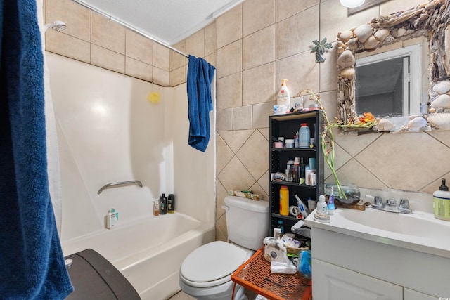 full bathroom featuring vanity, a textured ceiling, shower / bath combo with shower curtain, tile walls, and toilet