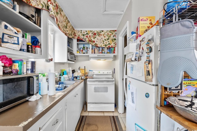 kitchen with light tile patterned floors, sink, white appliances, white cabinetry, and range hood