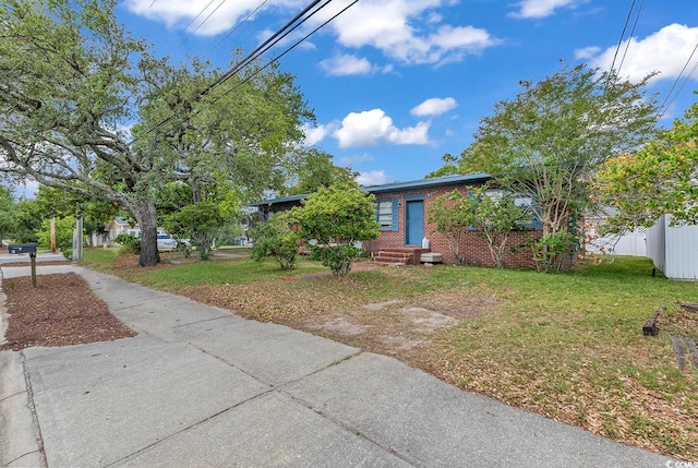 view of front of property with a front lawn