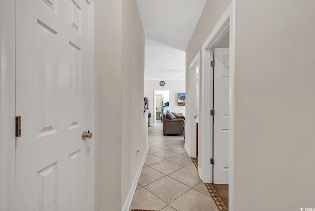 hall with light tile patterned flooring