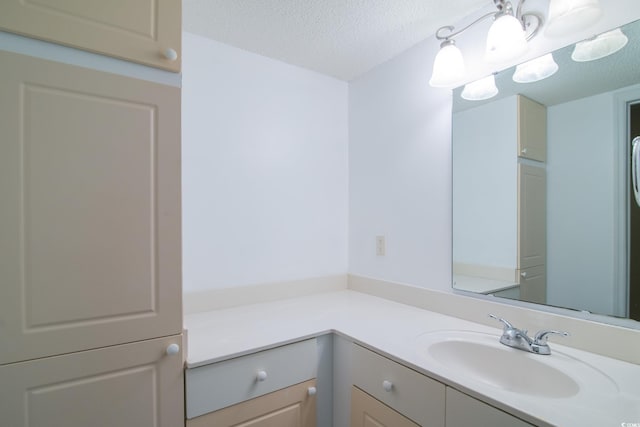 bathroom featuring vanity and a textured ceiling