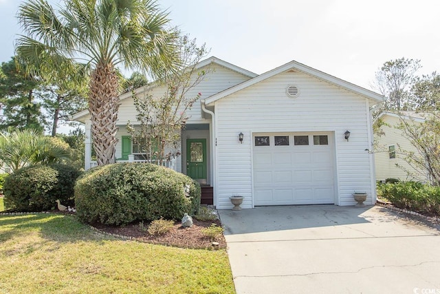 view of front of home featuring a garage and a front yard