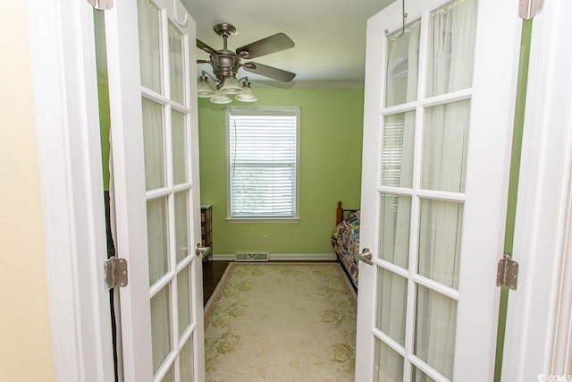 interior space with ceiling fan and french doors