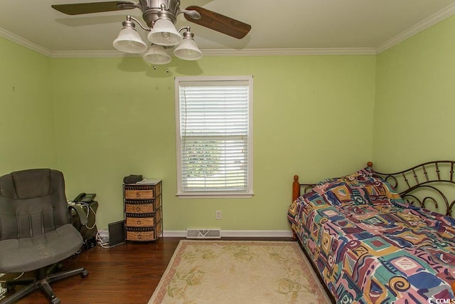 bedroom with ceiling fan, hardwood / wood-style flooring, and ornamental molding