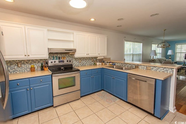 kitchen with sink, extractor fan, white cabinetry, blue cabinetry, and appliances with stainless steel finishes