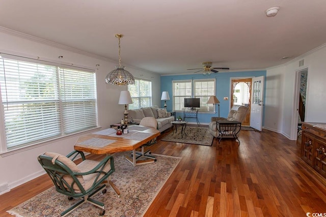 dining room featuring plenty of natural light, ornamental molding, dark hardwood / wood-style flooring, and ceiling fan