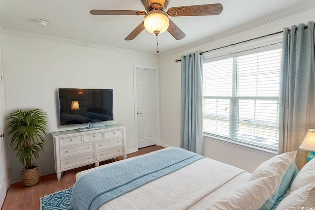 340 Walden Lake Rd, Conway, SC 29526 - bedroom with multiple windows, baseboards, wood finished floors, crown molding, and ceiling fan