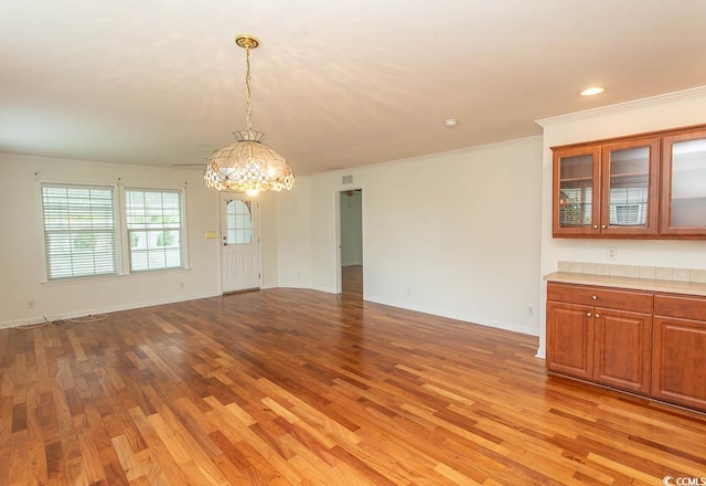 340 Walden Lake Rd, Conway, SC 29526 - unfurnished dining area featuring a chandelier, light wood-type flooring, ornamental molding, baseboards, and recessed lighting