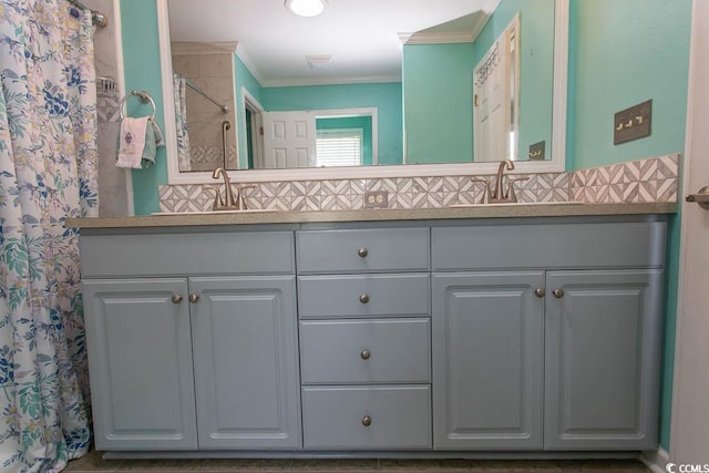 bathroom featuring a shower with curtain, vanity, and crown molding