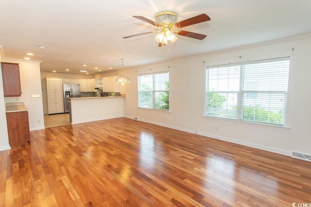 340 Walden Lake Rd, Conway, SC 29526 - unfurnished living room featuring light wood finished floors, baseboards, ornamental molding, a ceiling fan, and recessed lighting