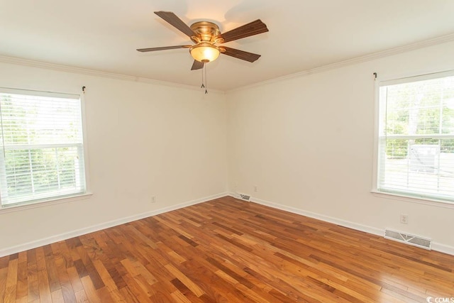 340 Walden Lake Rd, Conway, SC 29526 - spare room featuring wood-type flooring, plenty of natural light, ceiling fan, and crown molding
