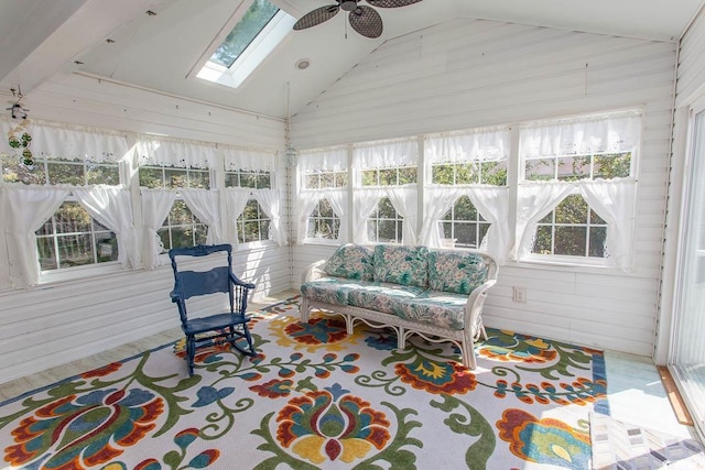 sunroom featuring ceiling fan and lofted ceiling with skylight