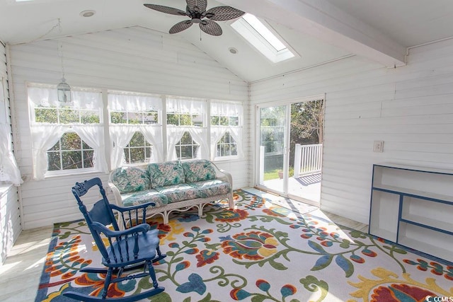 sunroom / solarium featuring ceiling fan and lofted ceiling with skylight