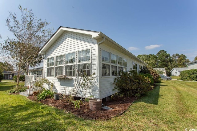 view of home's exterior featuring a lawn