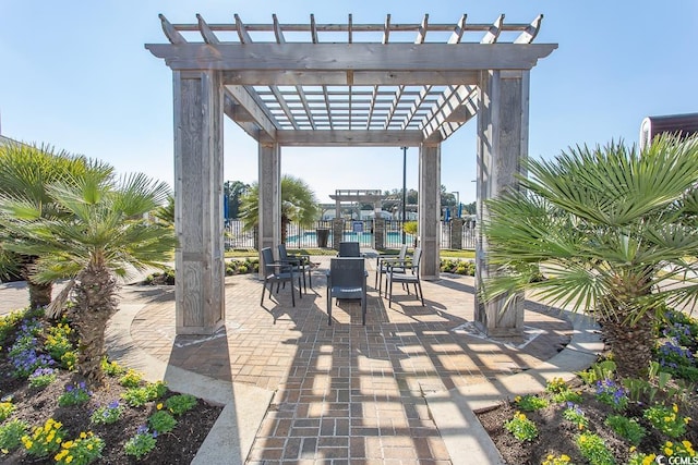 view of patio featuring a pergola