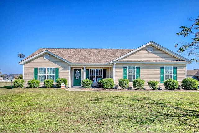 ranch-style house featuring a front lawn