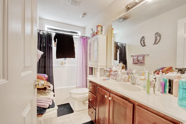 full bathroom with vanity, shower / tub combo, and toilet