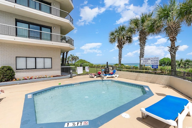 view of swimming pool featuring a patio area