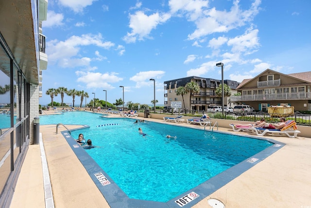 view of swimming pool with a patio area