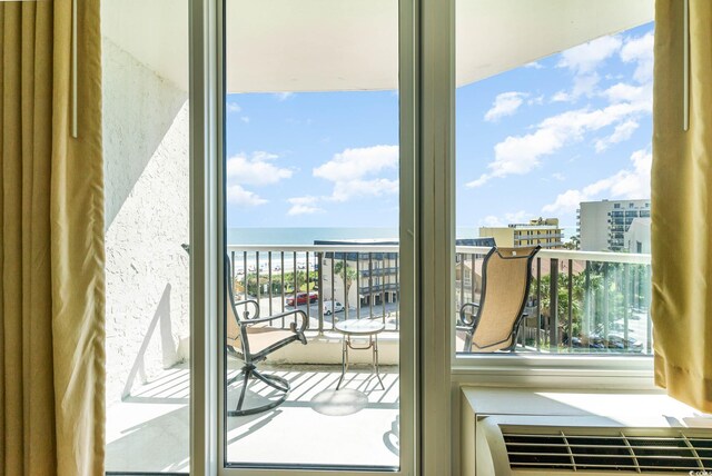 entryway featuring a water view and a healthy amount of sunlight