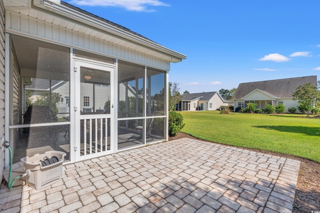 view of patio with a sunroom