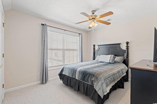 carpeted bedroom featuring lofted ceiling and ceiling fan