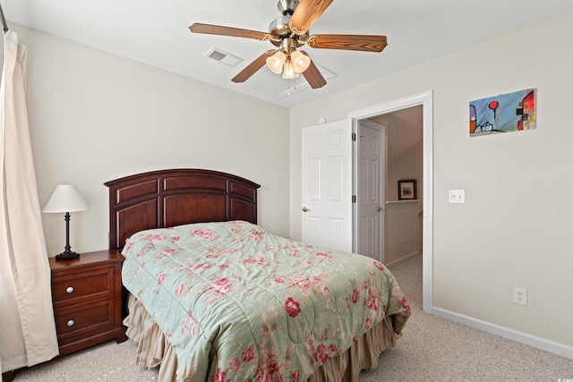 bedroom with ceiling fan and light carpet