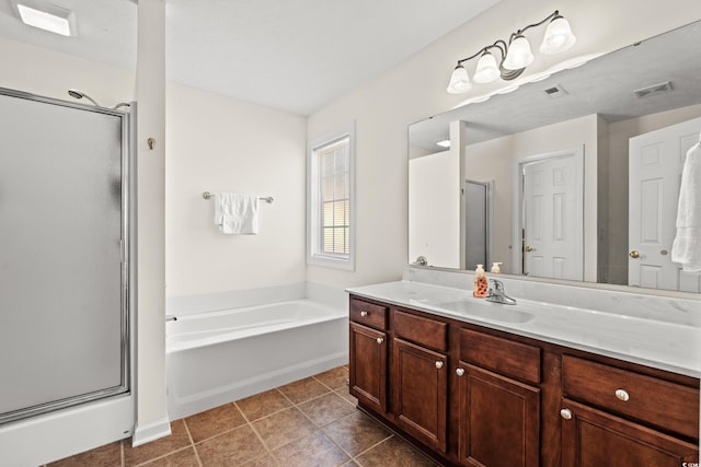 bathroom featuring plus walk in shower, tile patterned floors, and vanity