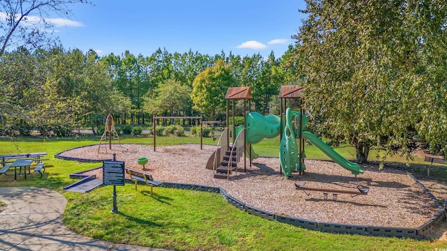 view of jungle gym featuring a lawn