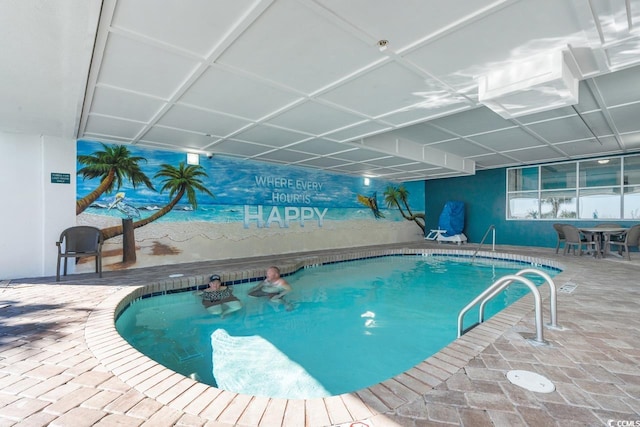 view of swimming pool with a patio