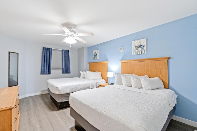 bedroom featuring light hardwood / wood-style floors and ceiling fan