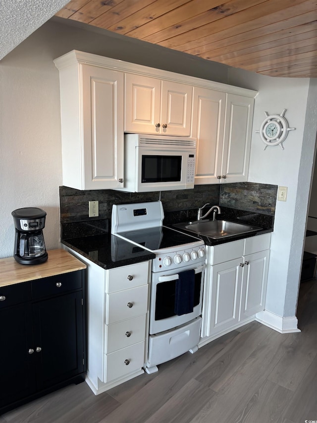 202 70th Ave N Unit 104, Myrtle Beach, SC 29572 - kitchen with white appliances, a sink, decorative backsplash, dark wood finished floors, and wooden ceiling